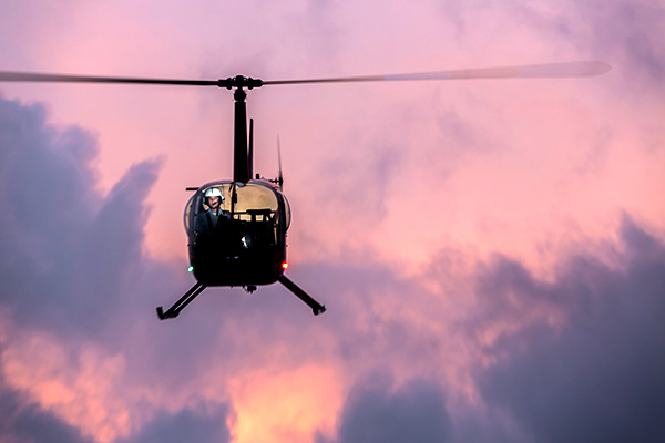 helicoptor flying, colorful sky